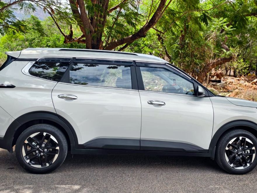 Silver Kia Carens seven-seater, side profile